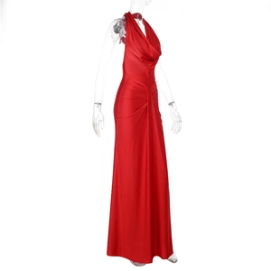 Side view of red satin backless halter dress showing sleek slim fit and draped details