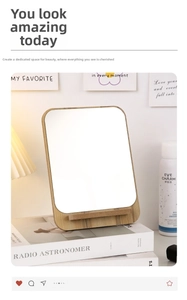 Detail view of the wooden desktop makeup mirror with a minimalist natural wood stand