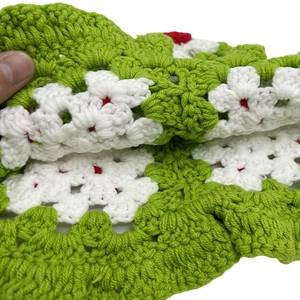 Handmade crochet knit baby hat featuring cute red cherries and white flower patterns
