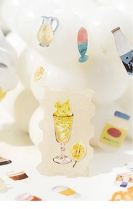 Close-up of watercolor lemon drink sticker with wavy edges for scrapbooking DIY