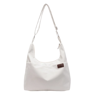 White nylon crescent crossbody bag with adjustable strap and fashion leather patch