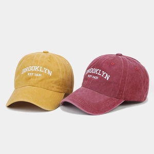 Vintage washed cotton baseball caps with Brooklyn embroidery in ginger and burgundy