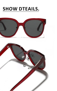Macro detail of wine red square sunglasses with gray lenses and metal nose pads