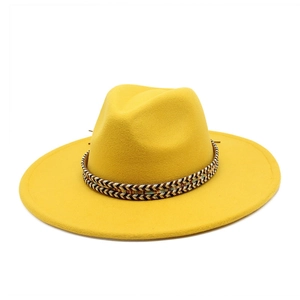 Detail of a bright yellow wool fedora with a black and gold braided decorative band