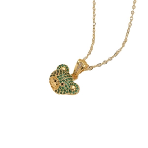 Golden necklace featuring a teddy bear pendant pave-set with vibrant green zircon stones