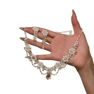 Elegant floral pearl and diamond jewelry set with necklace and drop earrings in silver