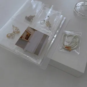 Portable transparent PVC jewelry storage album with multi-grid anti-oxidation dustproof slots