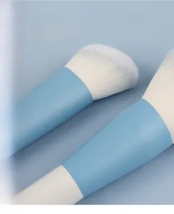 Macro detail of high-quality synthetic fiber makeup brushes with matte blue aluminum ferrules