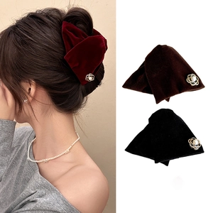 Elegant velvet flower hair claw clips with pearls shown in burgundy, brown and black