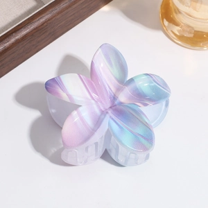 Detailed macro view of the iridescent gradient flower hair claw clip with marble texture