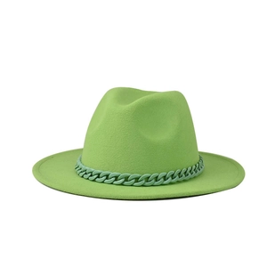 Detail of lime green fedora hat featuring a matching plastic chain decoration and wool texture