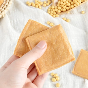 Realistic square PVC dried tofu model with fine cloth texture held by a hand