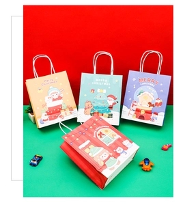 Detail of Christmas kraft paper gift bags featuring reindeer and Santa cartoon prints