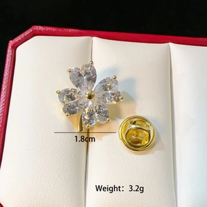 Detail of clover brooch with clear crystals, measuring 1.8cm and weighing 3.2g