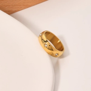Polished gold titanium steel ring with an eight-pointed star and inlaid crystal gem