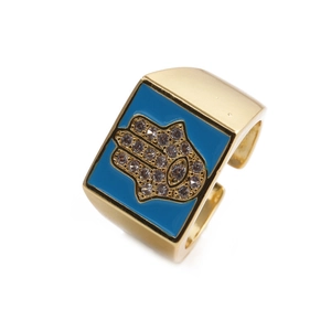Bague ouverte Main de Fatima dorée avec émail bleu et pierres de zircone cubiques