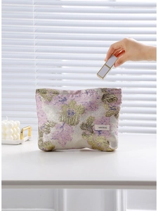 Trousse à maquillage jacquard vintage dorée avec motifs floraux violets et étiquette