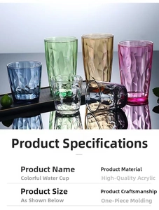 Detail of colorful acrylic cups with diamond texture reflecting on black glossy surface