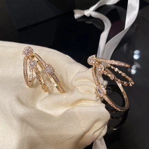 Three-layer gold geometric oval earrings with sparkling zircon stones and silver needles
