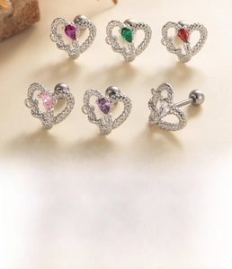 Detail showing colorful heart zircon stud earrings with surgical steel screw ball backs