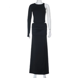 Detail of black one-shoulder long sleeve dress featuring waist cutout and ruched skirt