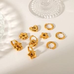 Golden stainless steel earring set featuring heart, flower, and star shaped pendant hoops