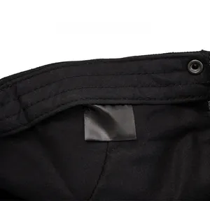 Detailed care label showing 20% cotton and 80% polyester fabric composition on a black hat