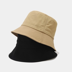 Detail view of double stitching on quick-dry black and beige nylon bucket hats