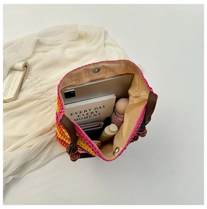 Top view of rainbow straw tote bag interior showing capacity for tablet and daily items