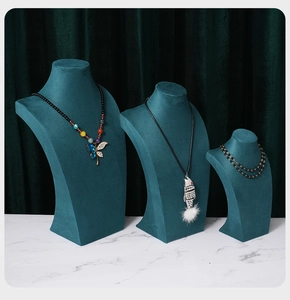 Three-piece dark teal velvet bust display set for necklaces in small, medium, and large sizes