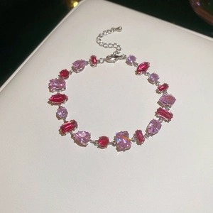 Macro shot of colorful wave zircon bracelet with drop-shaped and rectangular gems