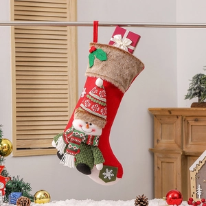 Large red Christmas stocking with snowman plush and fur trim hanging on a mantel