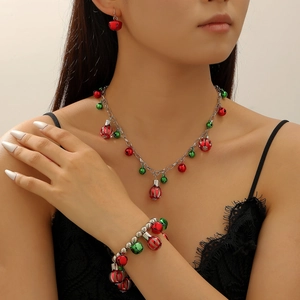 Christmas jewelry set with red and green bell pendants including necklace, bracelet and earrings