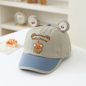 Close-up of Hello Bear embroidery and cute plush ears on a toddler baseball cap