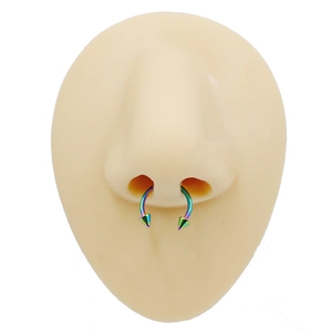 Rainbow stainless steel horseshoe septum ring with spiked ends on a silicone model