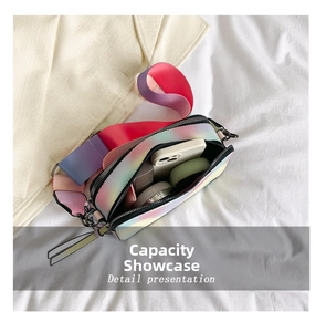 Top view of compact rainbow crossbody bag showing interior capacity with essentials