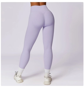 Detail view of high-waist lilac yoga pants with a V-shaped butt-lifting seam design