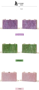 Detail of marble pattern acrylic evening clutch bags with gold metal chain straps