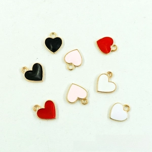 Detail of colorful heart-shaped alloy charms with gold plating for DIY jewelry