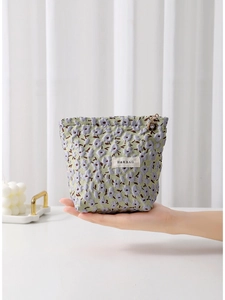 Floral jacquard makeup bag with purple flower pattern and drawstring closure