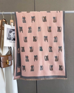 Close-up of pink cashmere-like scarf with cat patterns and grey fringed edges