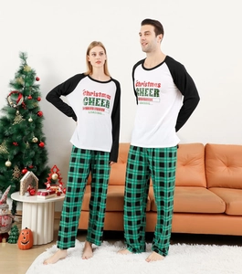 Detail of Christmas Cheer loading print on black and white raglan sleeve pajama top