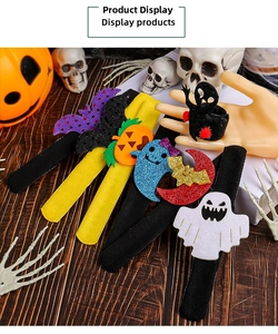 Detail of Halloween snap bracelets with felt bat, pumpkin, and glitter ghost designs