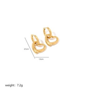 Detail view of gold hollow heart earrings with 2.5cm height and 1.6cm width dimensions