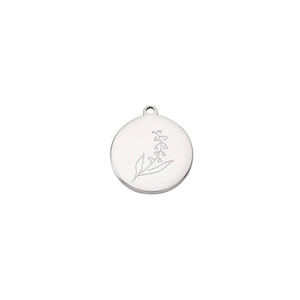 Close-up of a silver stainless steel round charm with lily of the valley engraving