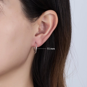 Close-up of 15mm sterling silver minimalist hoop earring on ear with S925 hallmark