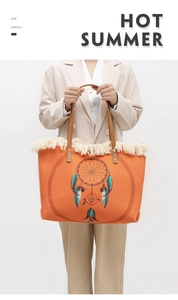 Detail of bohemian orange woven tote bag with fringe tassels and dreamcatcher design