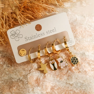Detailed set of six gold stainless steel earrings with animal and geometric designs