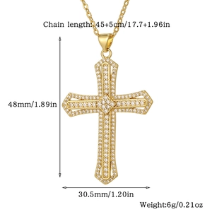 Detail view of gold cross necklace dimensions and sparkling white cubic zirconia stones