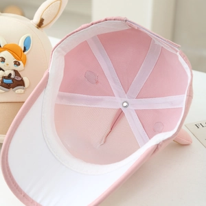 Detail of breathable mesh lining and fine stitching inside the pink bunny baseball cap